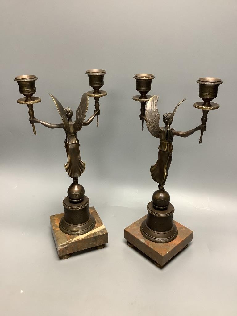 A pair of modern bronze figural two sconce candlesticks, height 32cm